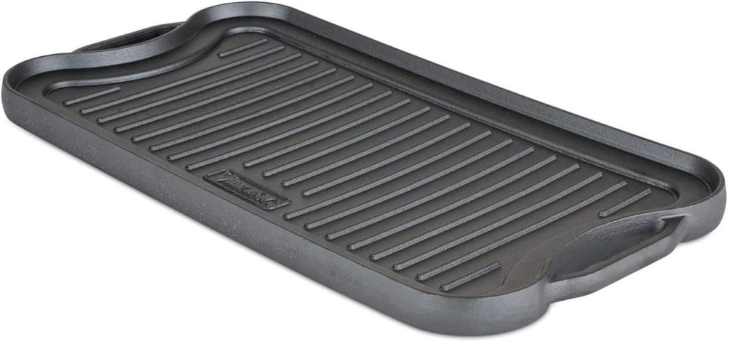 Reversible cast iron grill pan with ridges and handles, designed for grill cooking.
