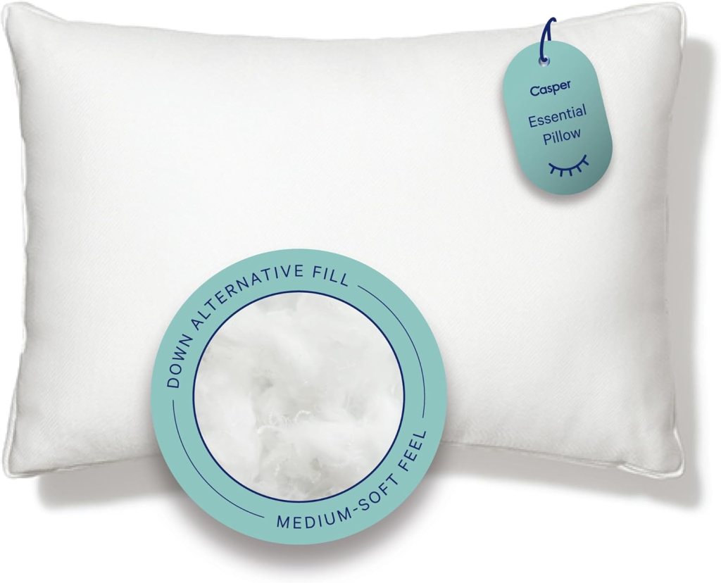 Casper Essential Pillow featuring a white cover and a tag indicating 'Down Alternative Fill' and 'Medium-Soft Feel'.