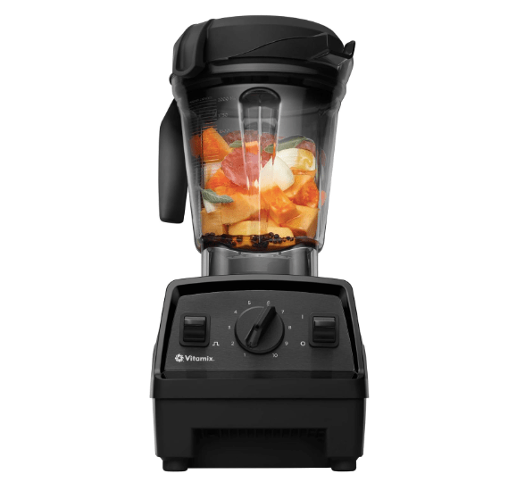 Vitamix Explorian Blender with a low-profile container filled with various chopped fruits and vegetables.