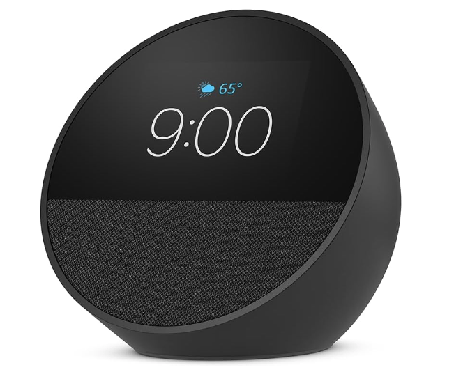 Black Amazon Echo Spot smart alarm clock displaying the time 9:00 and temperature 65 degrees.
