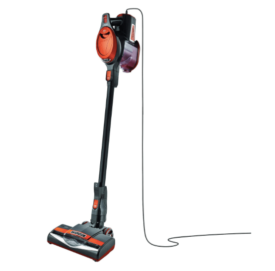A Shark Rocket Ultra-Light Corded Bagless Vacuum in gray and orange, featuring a swivel steering design, positioned upright with a power cord visible.