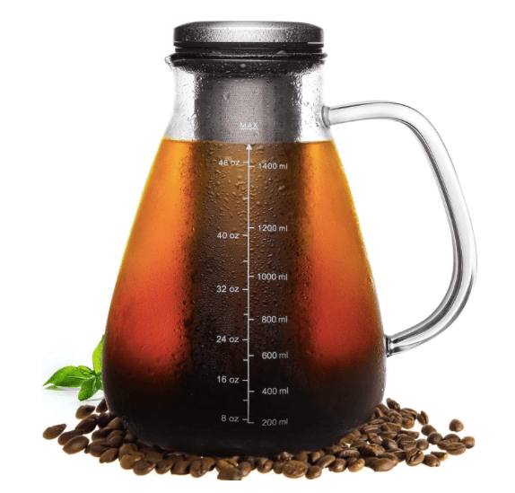 A 51oz cold brew coffee maker with a glass pitcher, featuring a removable stainless steel filter, placed on coffee beans.