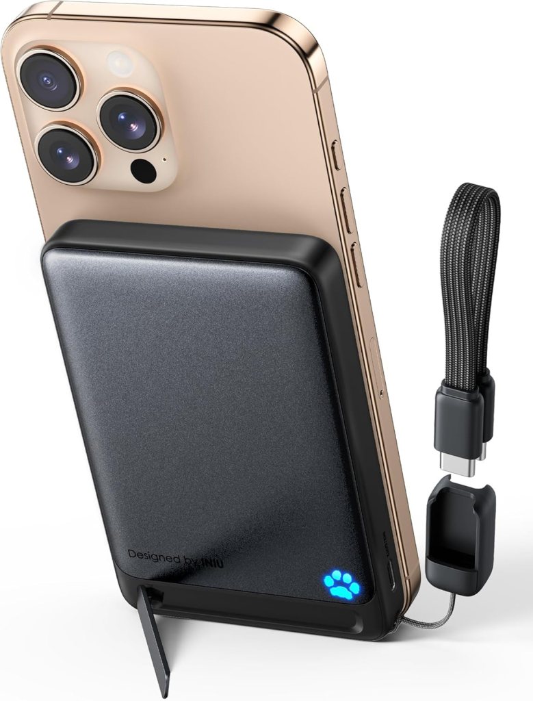 Close-up of an INIU portable charger attached to the back of a smartphone, displaying its slim design and magnetic connection.