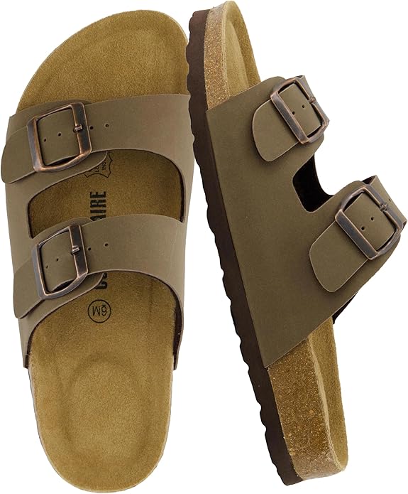 A pair of CUSHIONAIRE Lane Cork Footbed Sandals for women, featuring a comfortable double buckle design and genuine suede footbed, on a white background.