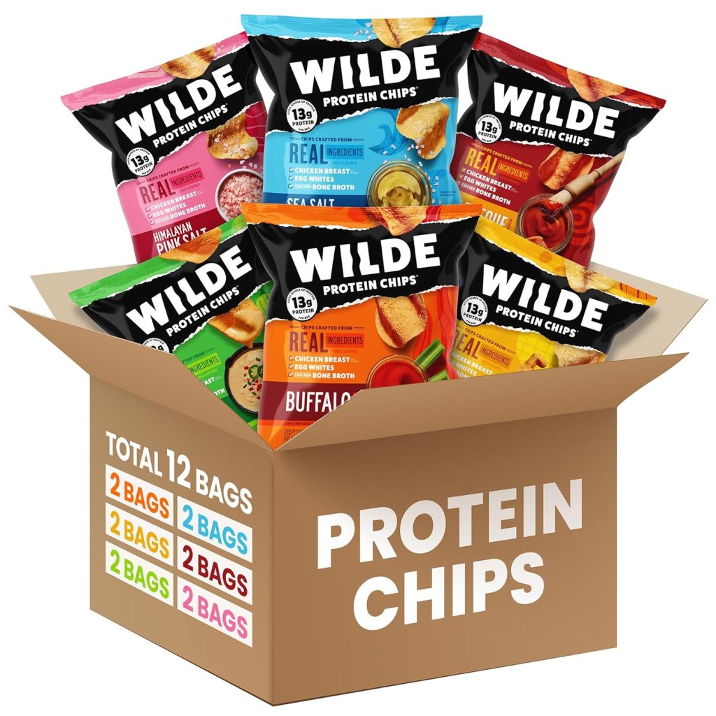 A box containing 12 bags of WILDE Protein Chips in various flavors, showcasing colorful packaging and prominently labeled as 'PROTEIN CHIPS'.