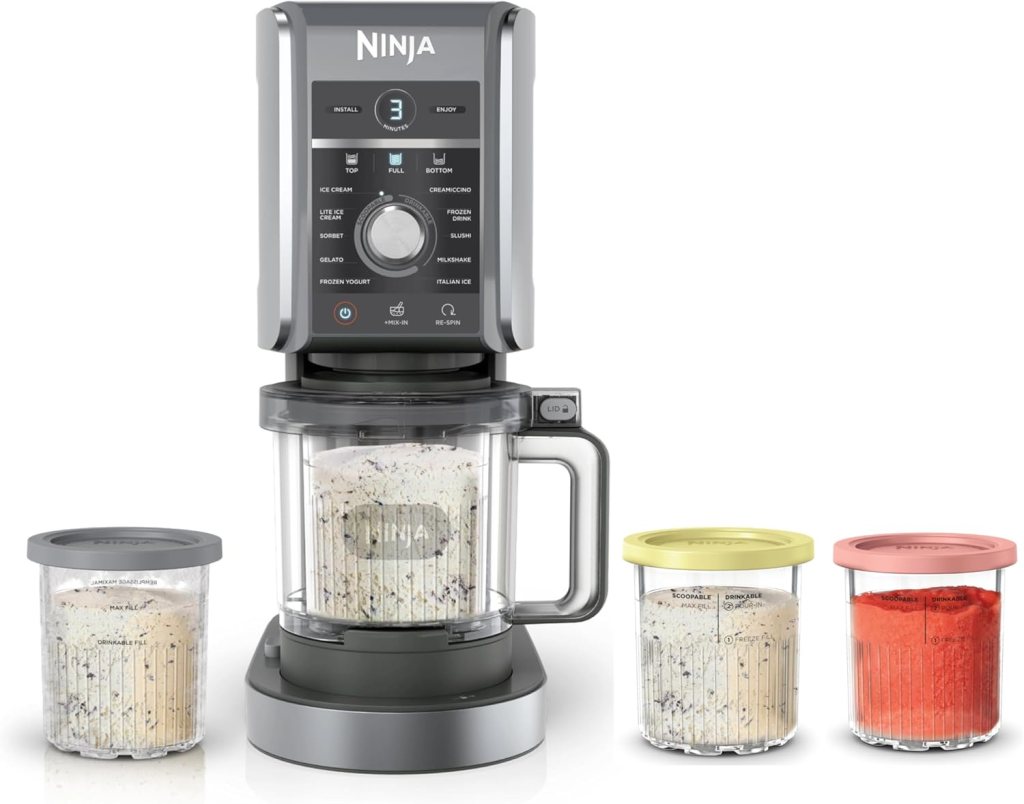 A Ninja CREAMi Deluxe Ice Cream and Frozen Treat Maker with three containers, showcasing different flavors of ice cream and sorbet.