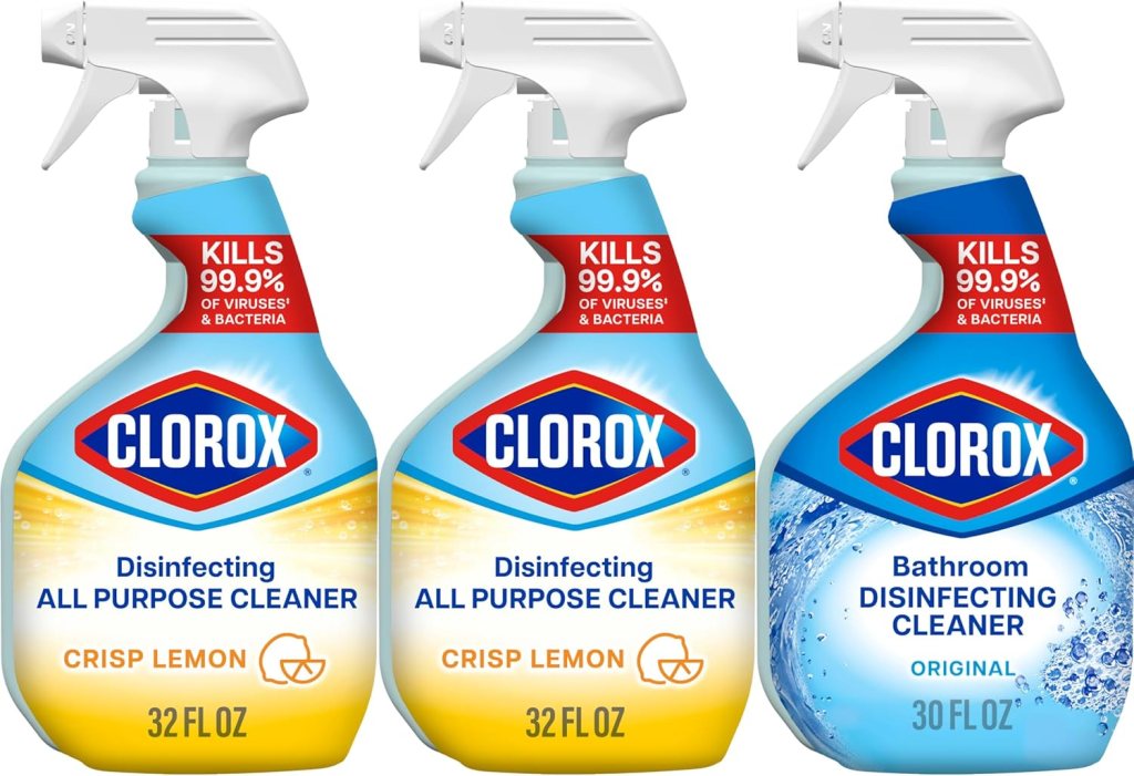 Three Clorox cleaning products: two bottles of Disinfecting All-Purpose Cleaner (32 oz, Crisp Lemon scent) and one bottle of Bathroom Disinfecting Cleaner (30 oz, Original scent), all displaying the Clorox logo and key features on the label.