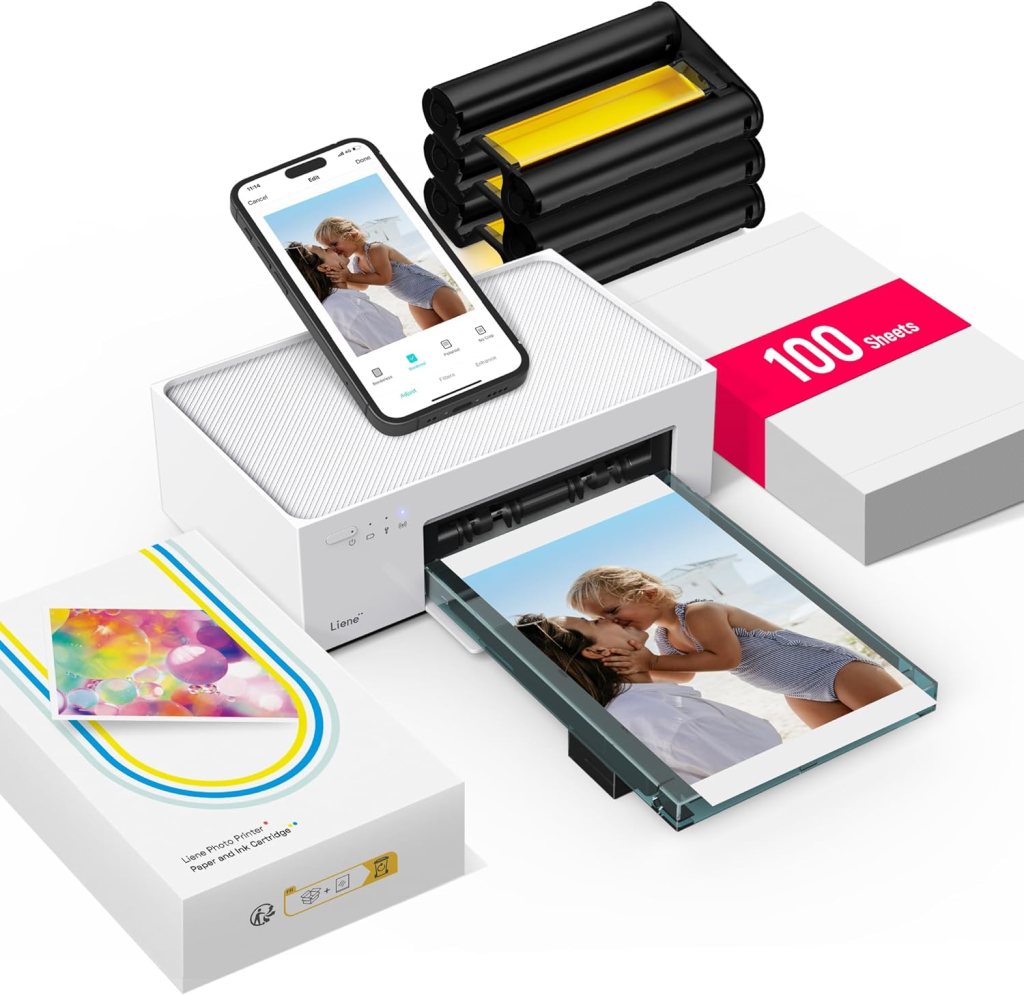 A Liene M100 4x6'' photo printer featuring a smartphone displaying a photo, surrounded by photo paper stacks and cartridges.