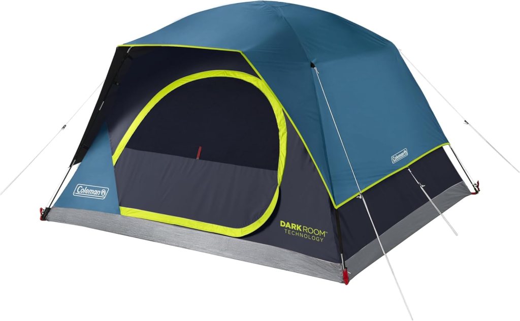 A Coleman Skydome Dark Room tent featuring a blue and gray design with a bright green trim, designed for easy setup and enhanced headroom.