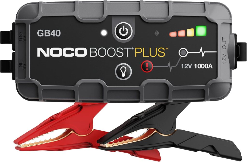 A NOCO Boost GB40 jump starter featuring a compact design with red and black clamps, designed for starting 12V vehicles.